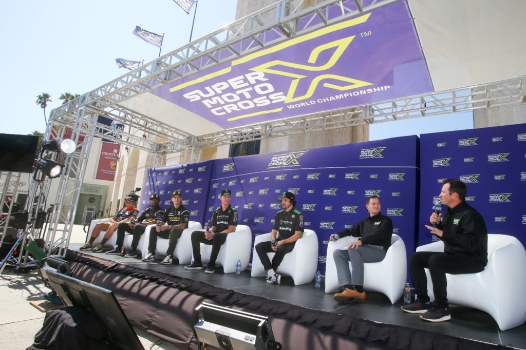 Elite Racers Cooper Webb, Malcolm Stewart, Christian Craig, Adam Cianciarulo, and Jason Anderson speaking with hosts Jason Weigandt and Daniel Blair at the SuperMotocross World Championship press event staged at the Los Angeles Memorial Coliseum in Los Angeles. Photo Credit: Feld Motor Sports