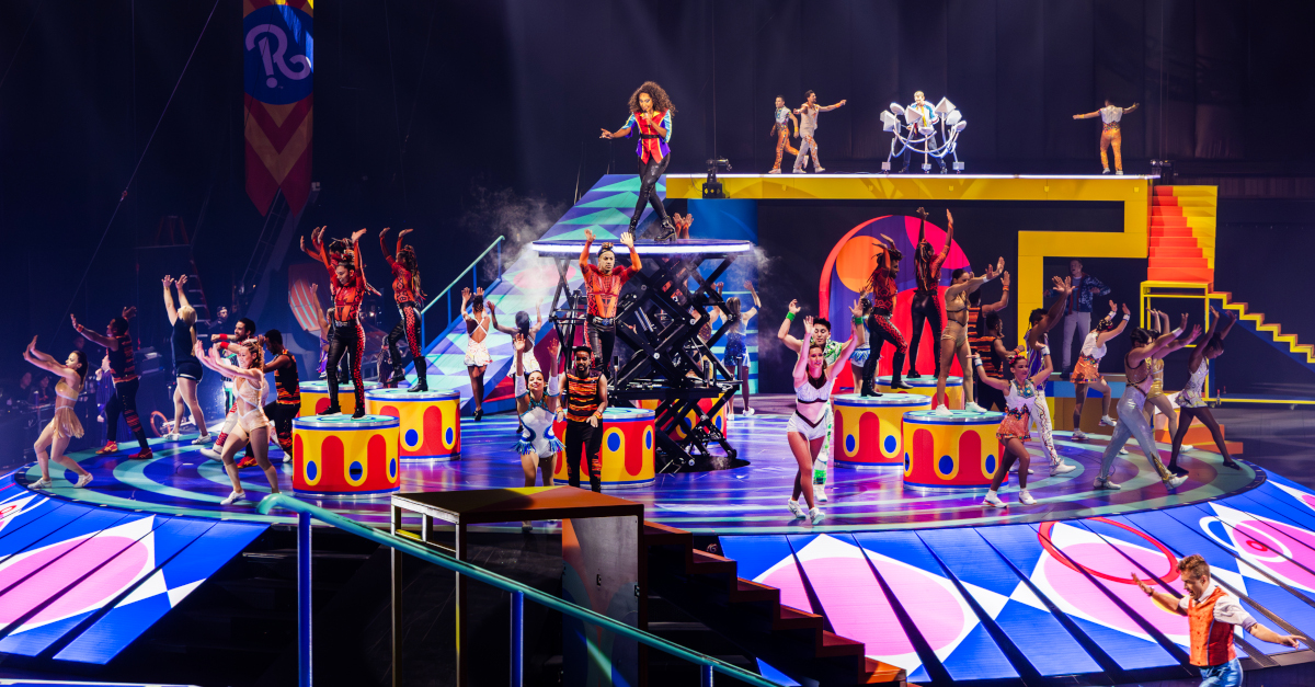 Wide photo of various acts being performed on stage at the Ringling Bros. circus.