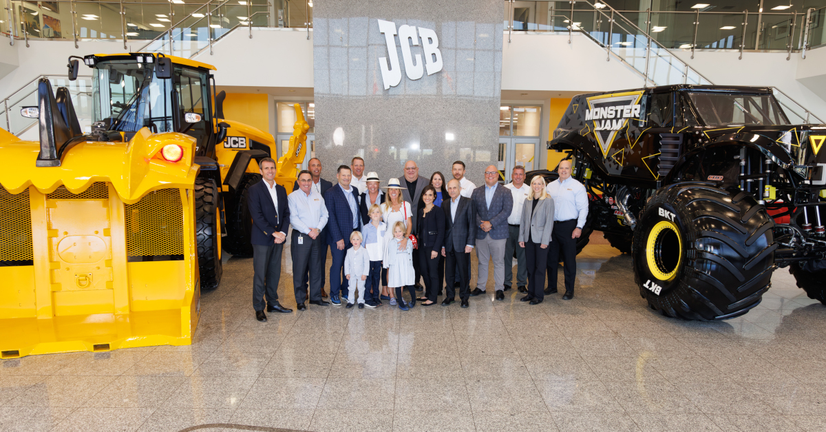 Feld and JCB employees inside the JCB office