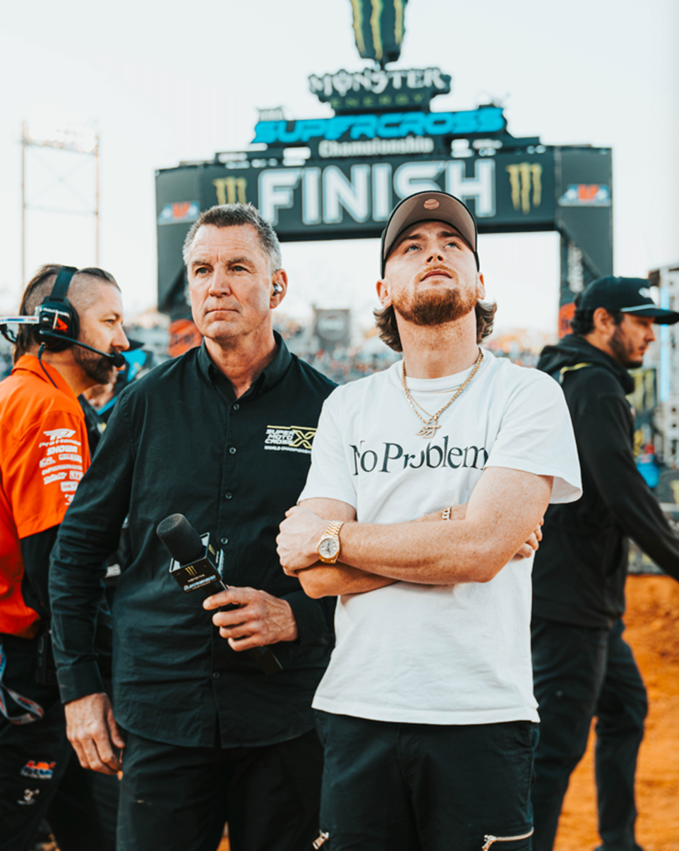 Platinum selling country artist Bailey Zimmerman getting the Alabama audience fired up for racing at Protective Stadium in Birmingham, Alabama. Photo credit: Issac Mason