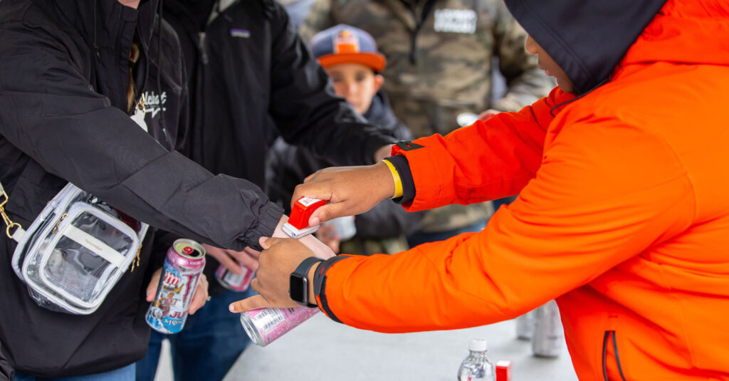Since 2009, fans who recycle an empty can of Monster Energy at the entrance of FanFest are hand stamped and granted complimentary entry.